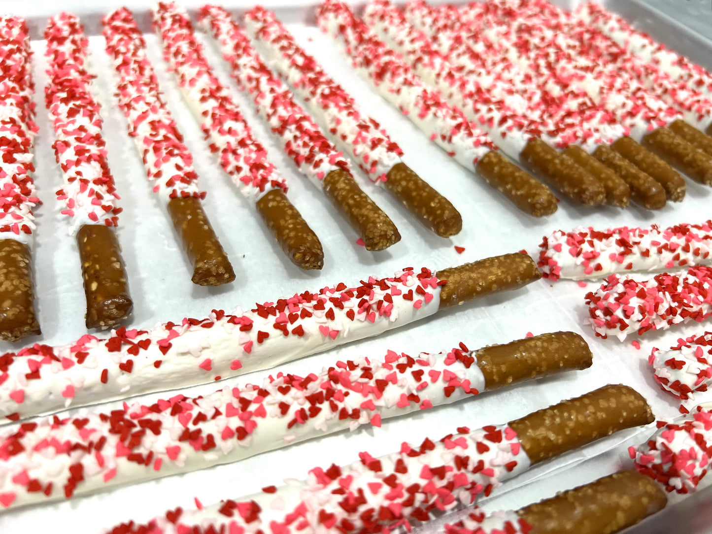 Mother's Day White Chocolate Pretzel Rods with Heart Sprinkles